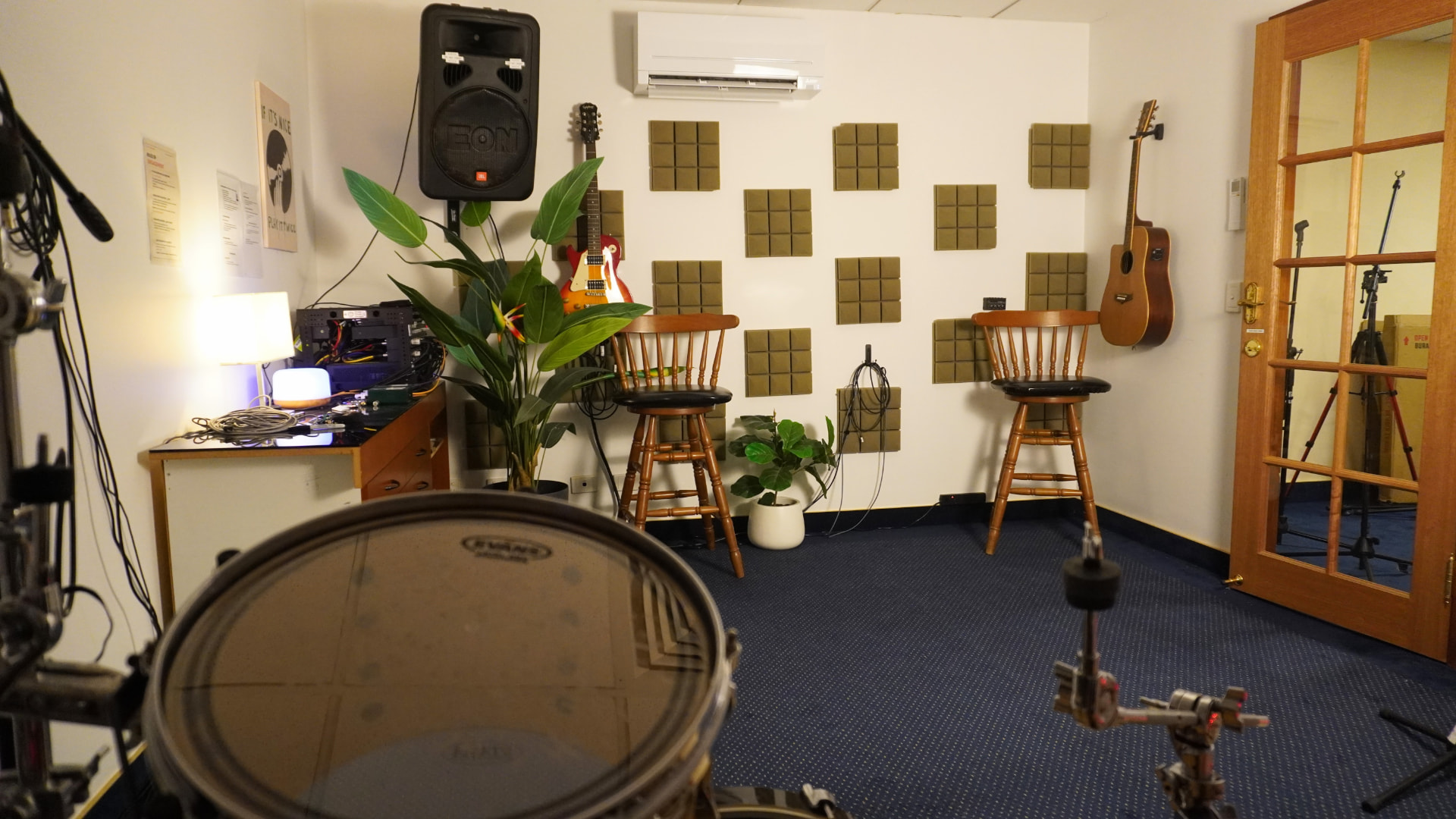 Wide view across the Tarragindi rehearsal room from behind the drum kit